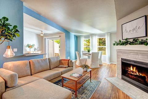 a living room with a fireplace and a couch